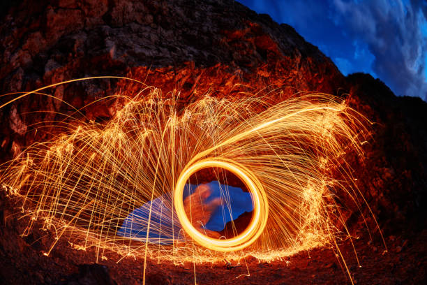 istock eyes are painted burning steel wool in the mountain 835497024