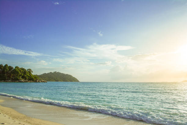 istock Beautiful seascape with blue sky and orange sunlight 835502220
