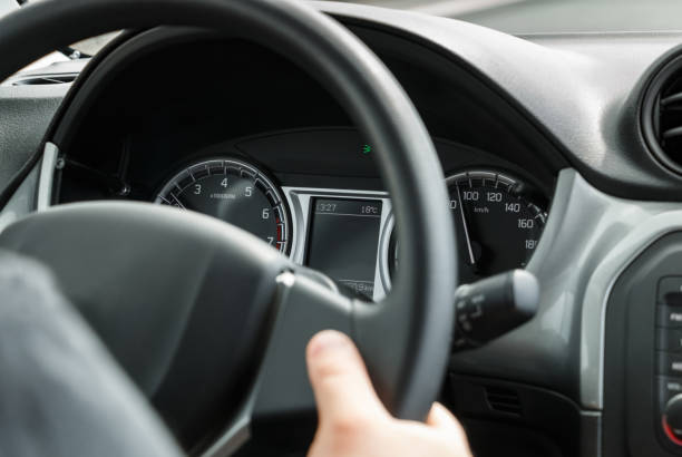 istock Man driving a car with his hands on the steering wheel 835502790