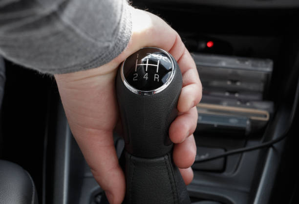 istock Closeup of male hand on gearshift stick 835503246