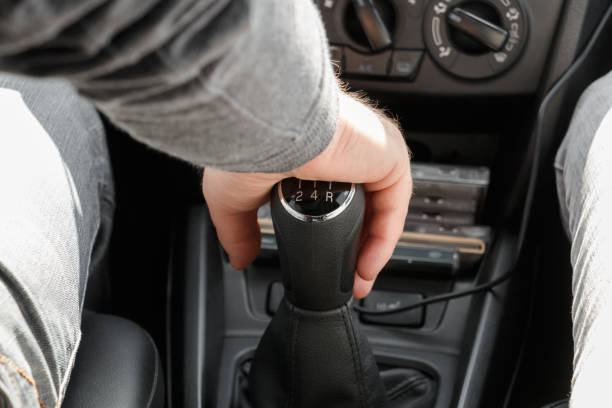 istock Closeup of male hand on gearshift stick 835503522