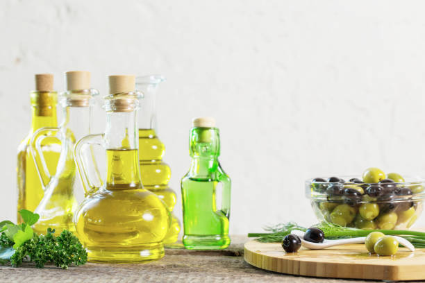 istock Olive oil  on the wooden table 835513596