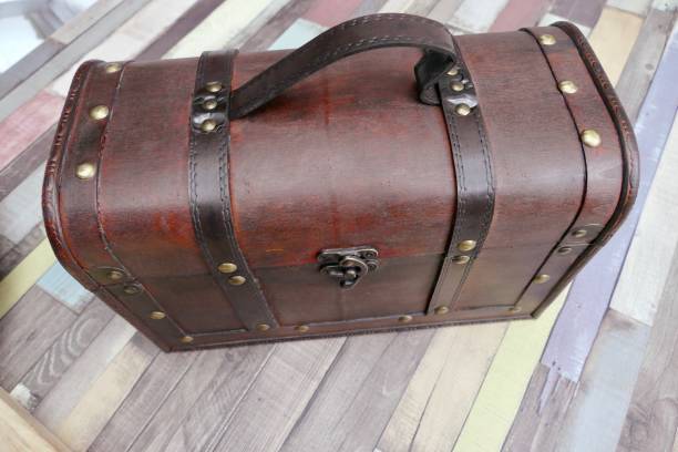istock Wooden treasure box standing on wooden table 835517010