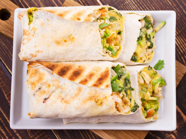 istock Chicken, avocado, cilantro and cheese burritos 835528212