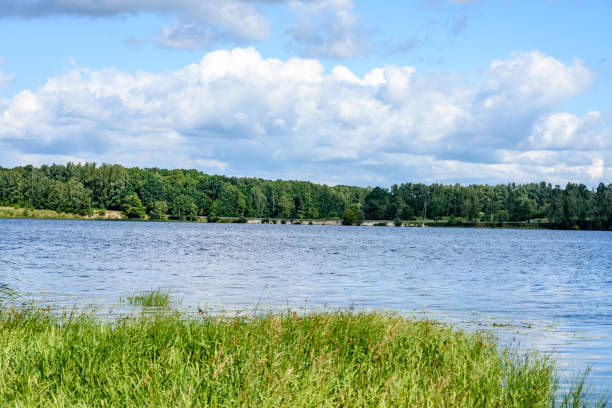 istock colorful clouds over the summer lake 835545984