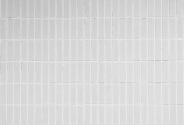 White ceramic brick tile wall or White tile floor seamless background and texture stock photo