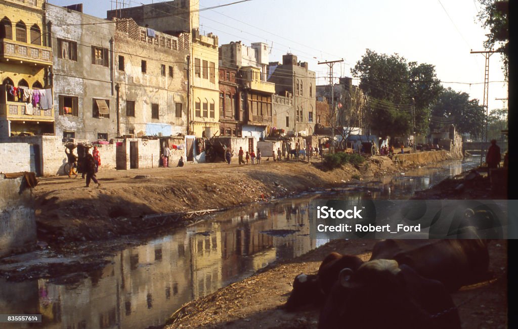 Backstreets along a canal in the old city section of Lahore Pakistan Pakistan Stock Photo
