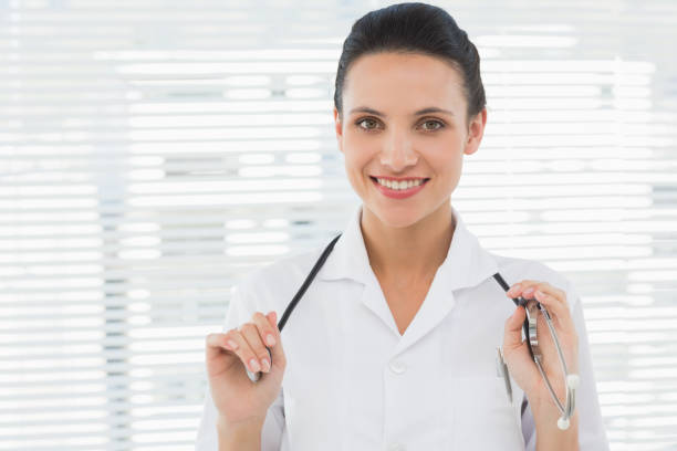 istock Beautiful confident female doctor with stethoscope 835562582