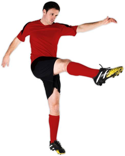 istock Football player in red kicking 835563046