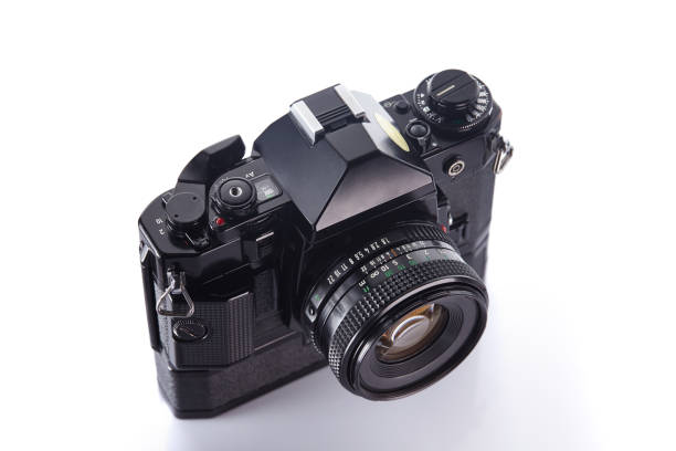 istock Old vintage film camera with lens on white background 835607020
