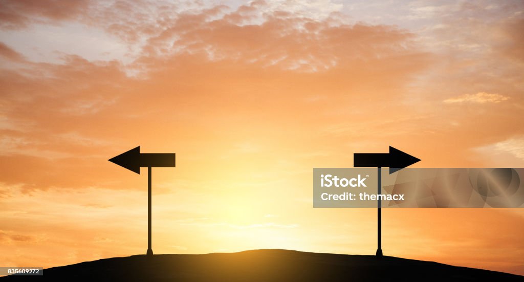 Direction arrow sign Direction arrow sign with sun light. Two Objects Stock Photo