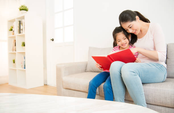 istock mother and little girl reading a book 835616972