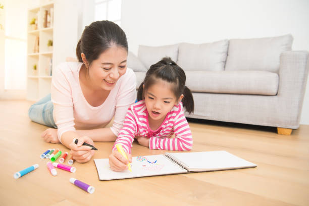istock mother and daughter together paint 835619888