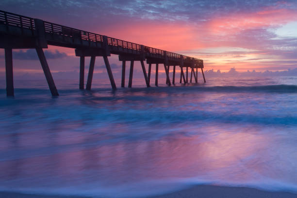 istock Sunrise at the ocean by the pier 835619986