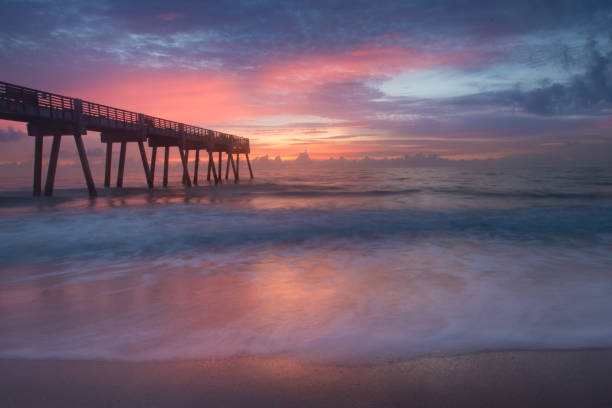 istock Sunrise at the ocean by the pier 835620192