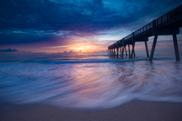 istock Sunrise at the ocean by the pier 835620904