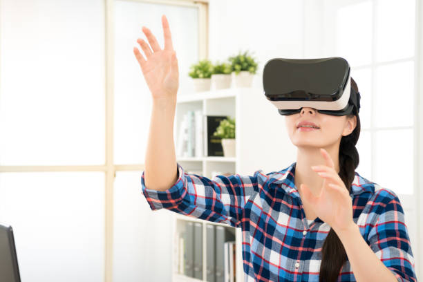 istock close up of woman getting using VR-headset 835625630