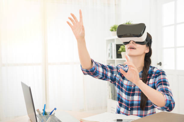 istock woman in virtual reality headset looking up 835626744