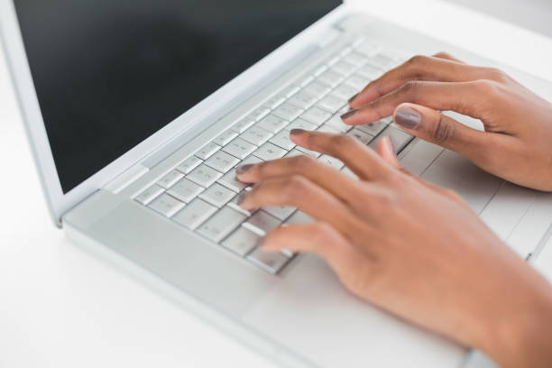 istock Close up on womans hands typing on her laptop 835628734