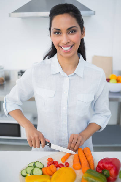 istock Content black haired woman smiling at camera 835629138