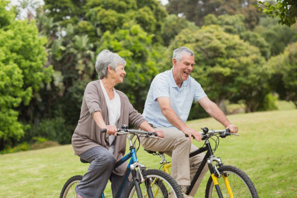 istock Senior couple on cycle ride in countryside 835631816