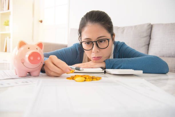 istock woman hold pan counting money upset 835635416