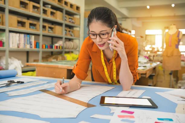 istock woman designer talking on the mobile phone 835638758