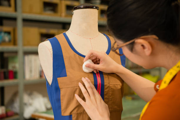istock female clothing design tailor working in dummy 835639116