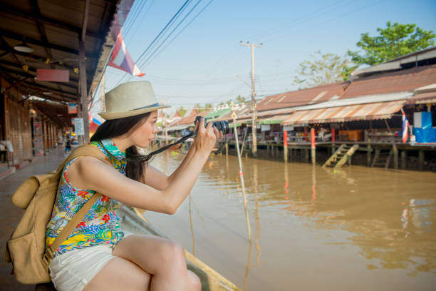 istock asian woman taking pictures seriously 835644594