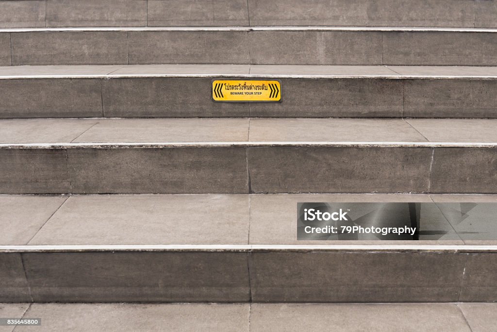 Yellow Warning Step Paved Grey Public Steps With A Yellow Beware Your Step Caution Sign ...