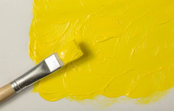 istock Yellow paint with paintbrush 835649696