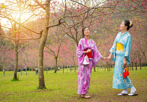 istock happy japanese girlfriends holding hands 835650530