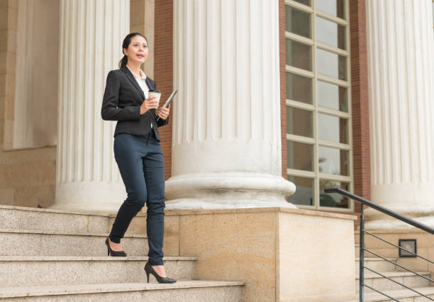 istock woman holding digital tablet and coffee paper cup 835677354