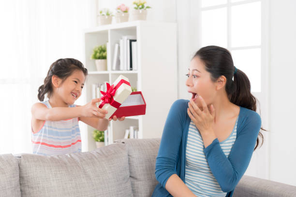 istock young mother sitting on the couch at home 835677674