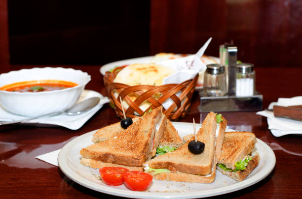 istock Toast sandwich with ham, vegetables and olives 835683380