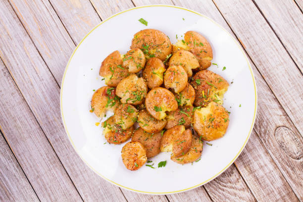 istock Smashed Potatoes with parsley and rosemary 835700676