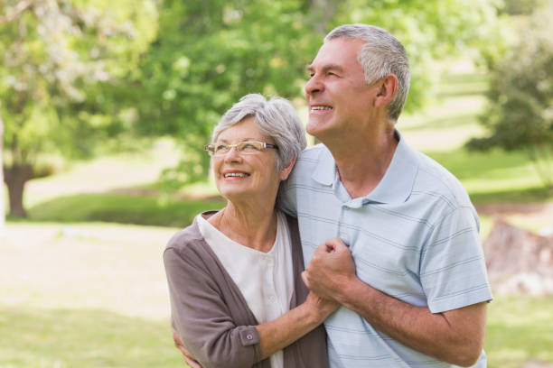 istock Loving senior couple holding hands at park 835700866