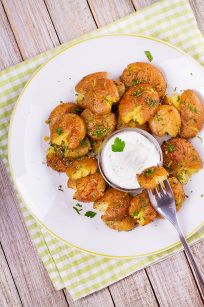 istock Smashed Potatoes with parsley and rosemary 835703384
