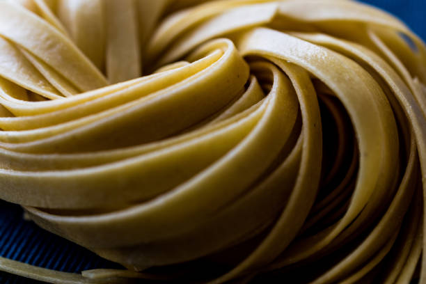 Raw Tagliatelle / Uncooked Pasta or Spaghetti.
