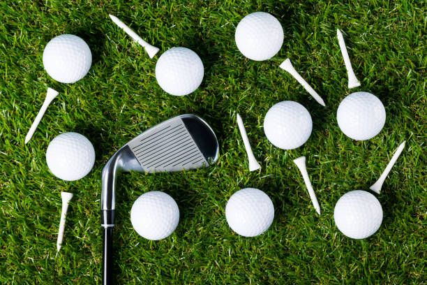 istock Many balls and other objects for playing golf on the lawn as a background 835727628