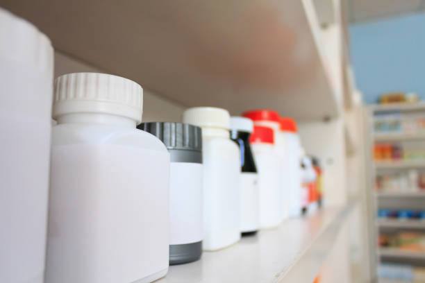 istock medicine bottles arranged on shelf at drugstore 835729808
