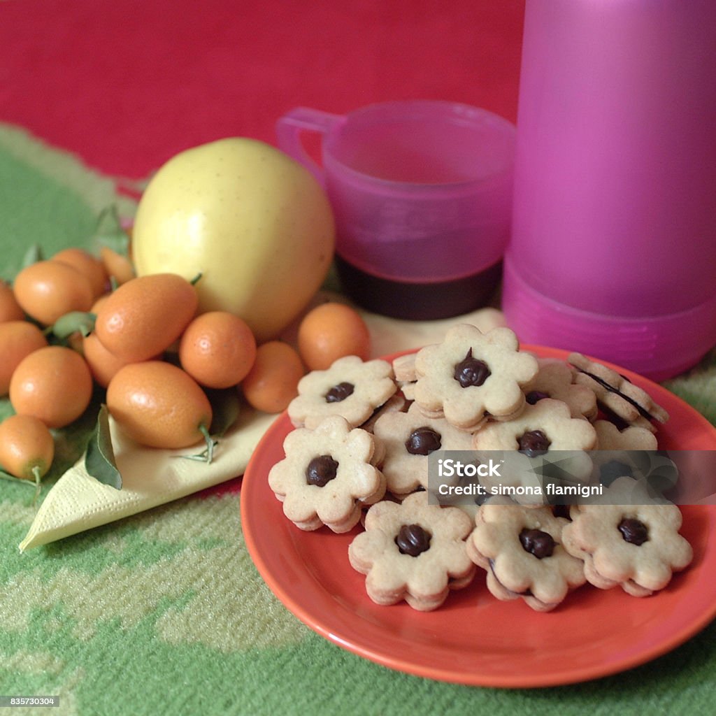 Flower shaped chocolate biscuits Apple - Fruit Stock Photo