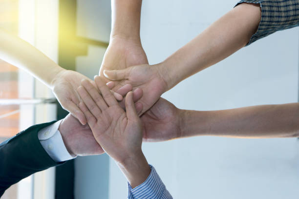 istock Hand together in the business office show teamwork 835732558