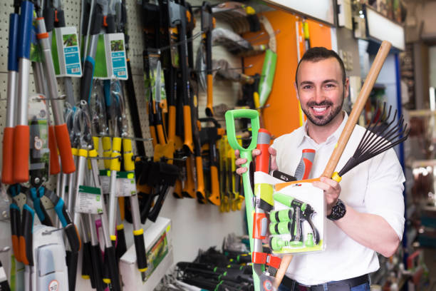 istock Man selecting gardening equipment in store 835732878
