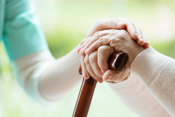 istock Nurse comforting elder lady 835733130