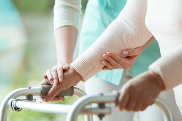 Close-up of metal walker Close-up photo of patient's hands placed on metal walker mobility walker stock pictures, royalty-free photos & images