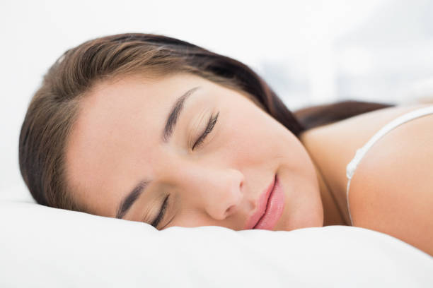 istock Pretty woman sleeping in bed 835733166