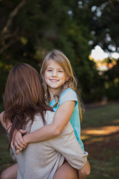 istock Mother holding her daughter in arms 835735888