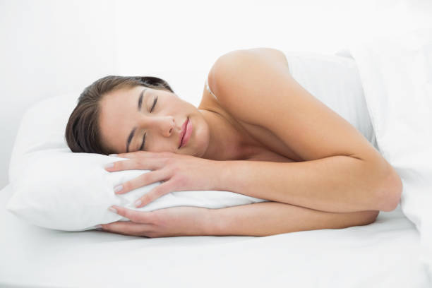 istock Pretty woman sleeping in bed 835743446
