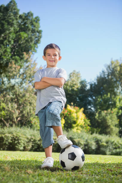 istock Young boy posing with football 835746396